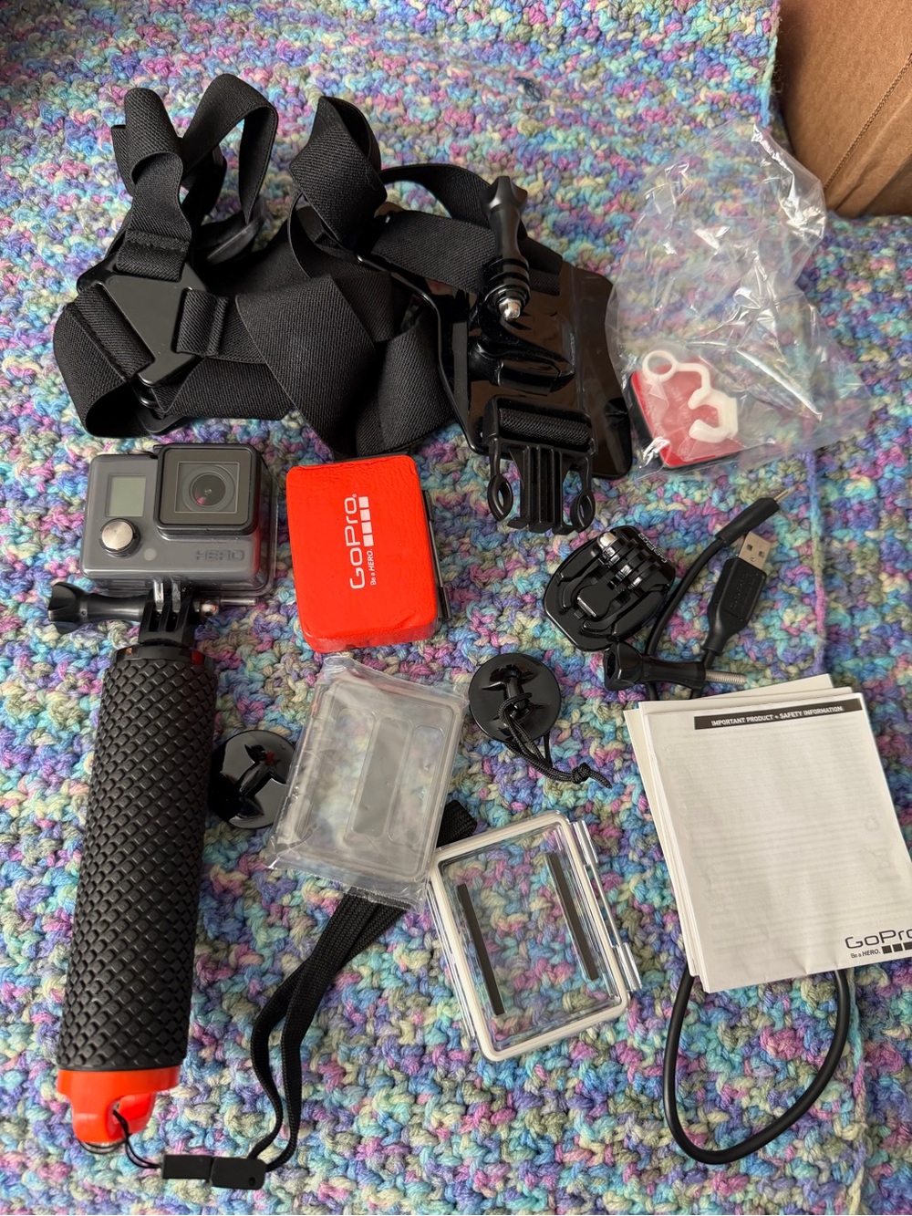 GoPro action camera bundle with black body and red float grip